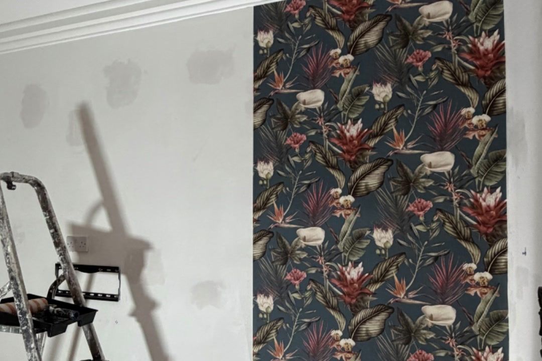 Wallpaper going up beside the ladder