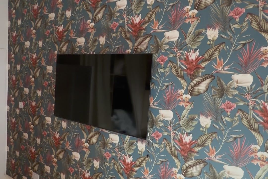 Finished floral feature wall with the TV remounted