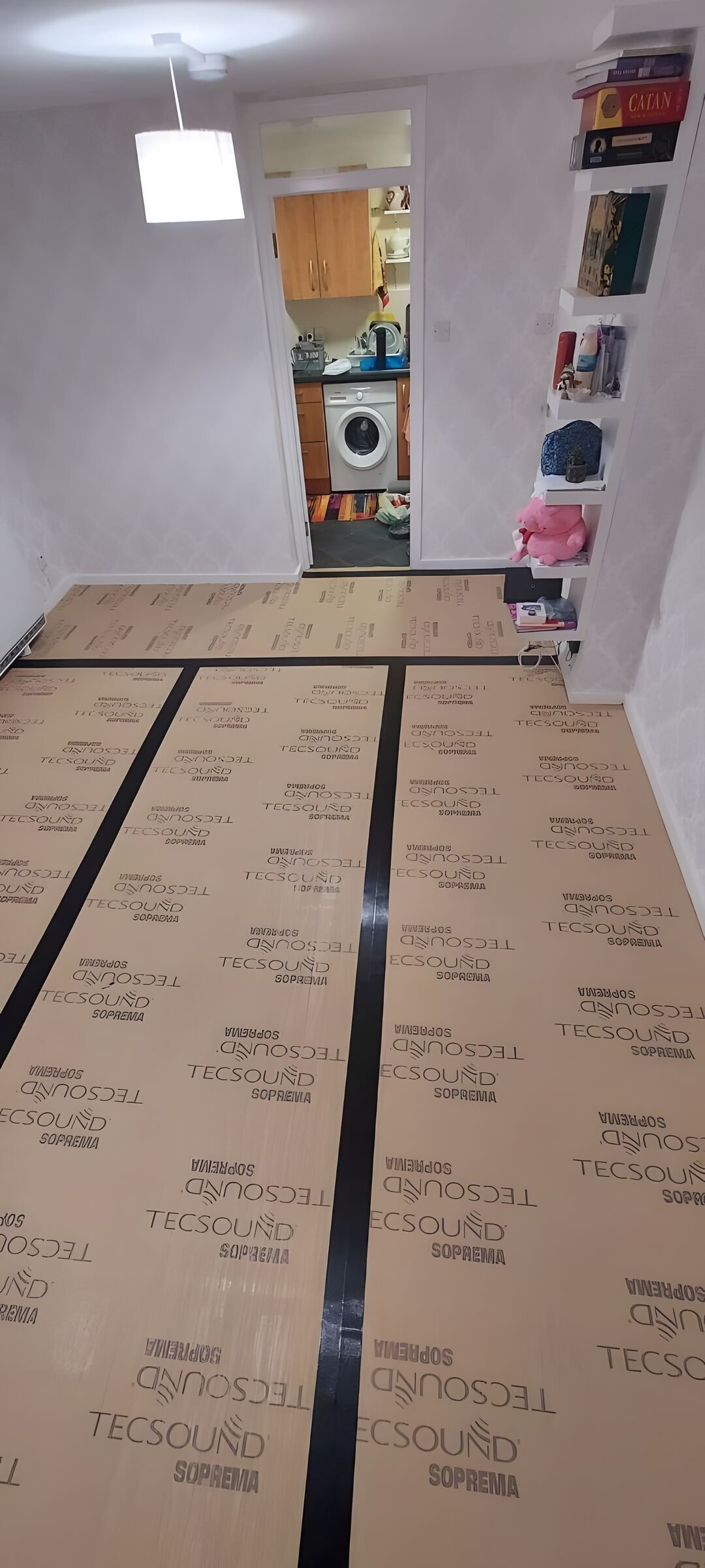 Living room floor covered with acoustic underlay