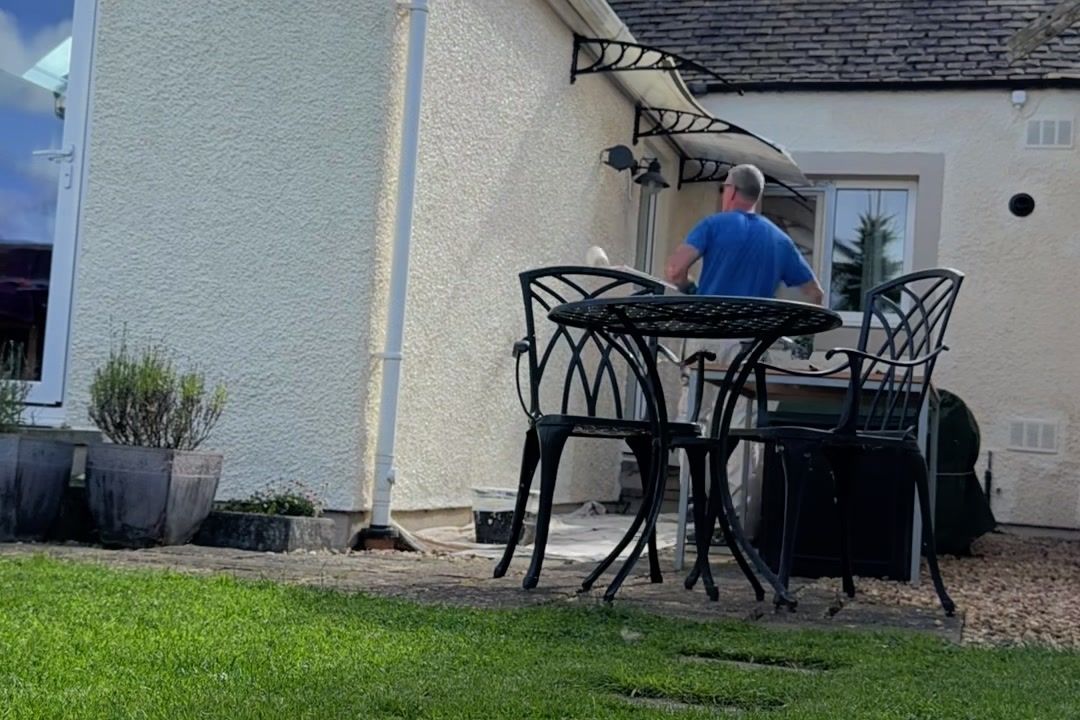 Painting the render in the back garden