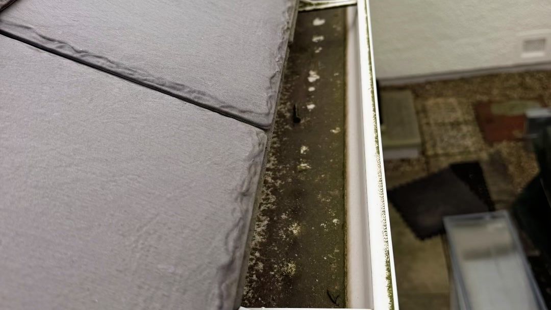 Cleared gutter and slates