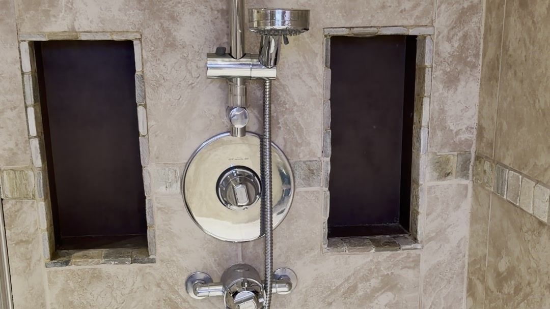 Finished re-tiled shower with recessed niches